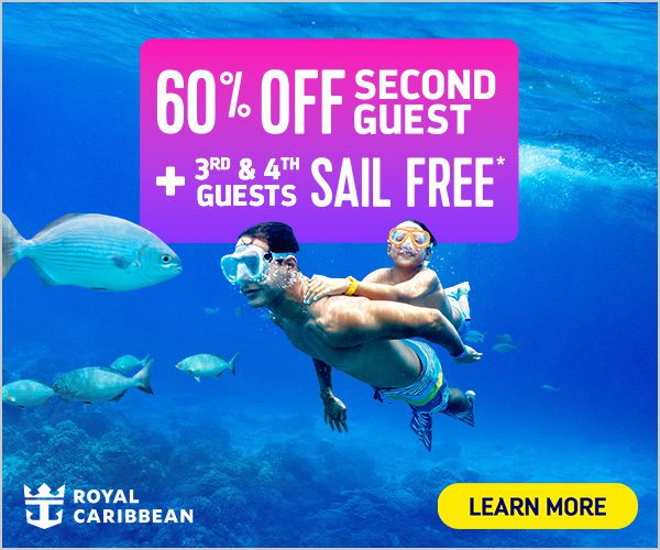 Man and child swimming underwater together